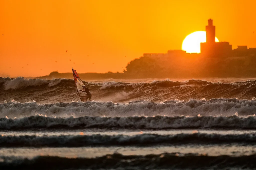 Sunset windsurfing session in Essaouira with view of Mogador Island