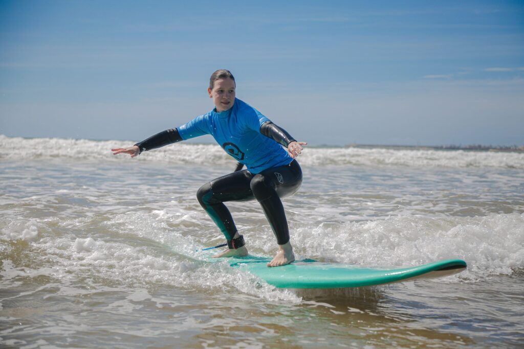 Young surfer riding a wave during a surf lesson in Essaouira with Explora Watersports